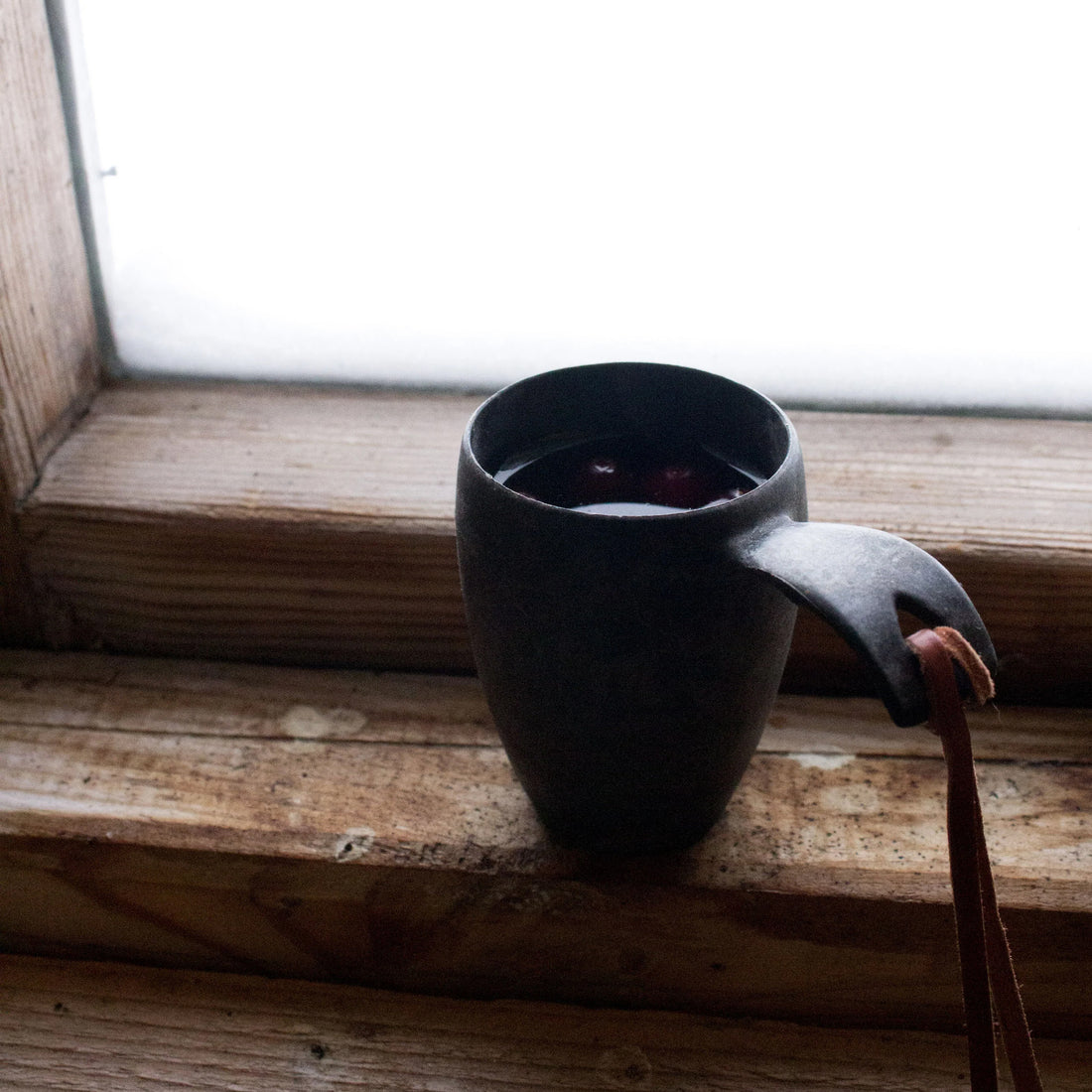 Kupilka 5 Shot Cup with leather cord kelo black